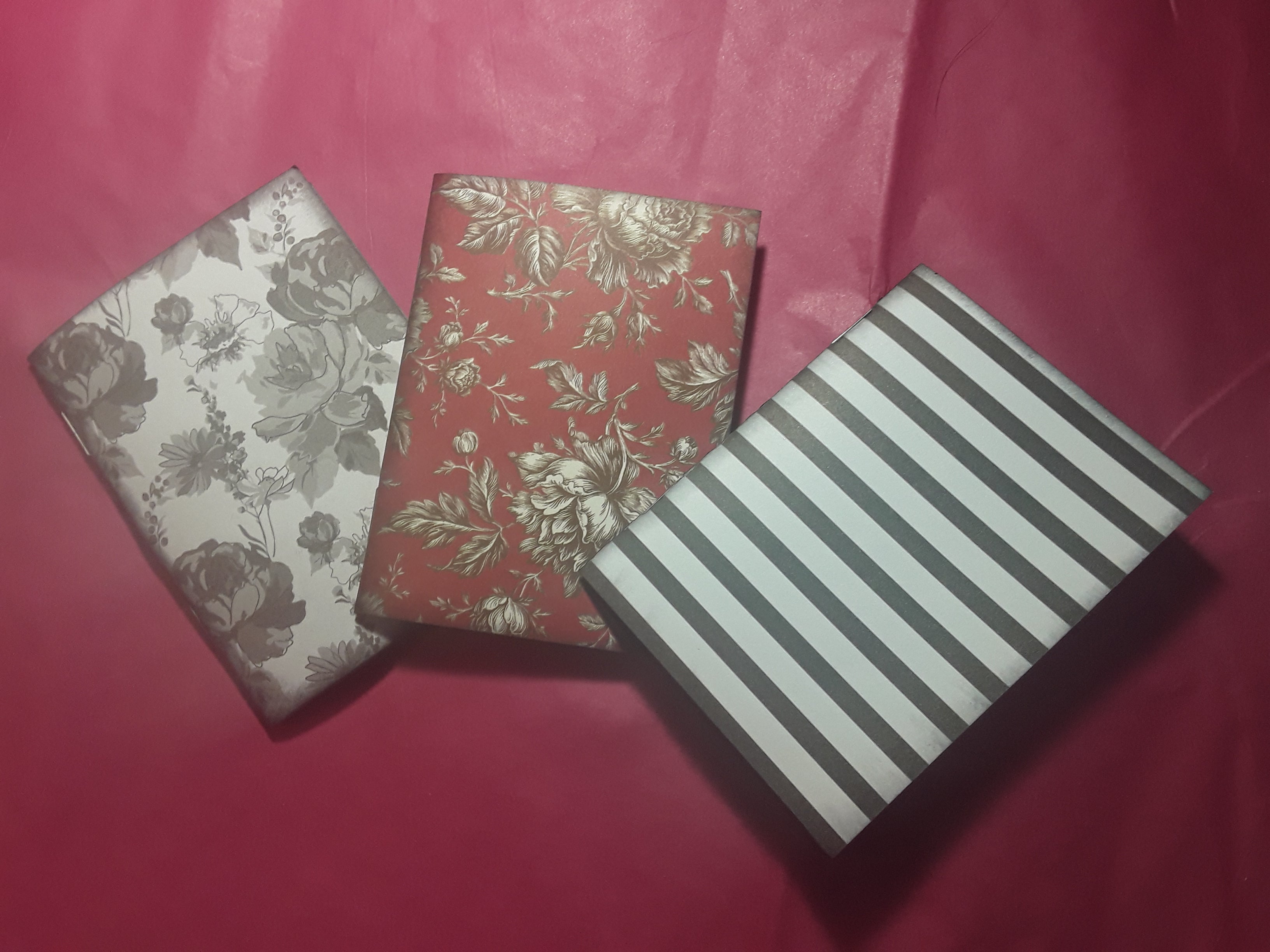 Three Medium Sized Notebooks