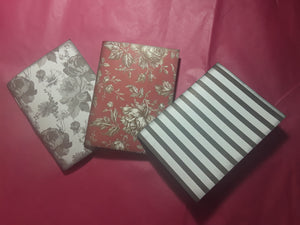 Three Medium Sized Notebooks