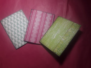 Three Medium Sized Notebooks